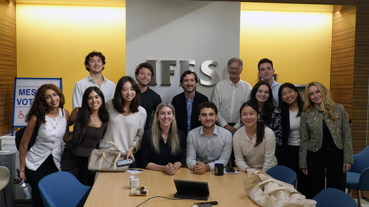 Honors students pose with Jean Schidler, Chief of Staff, at the International Foundation for Electoral Systems.