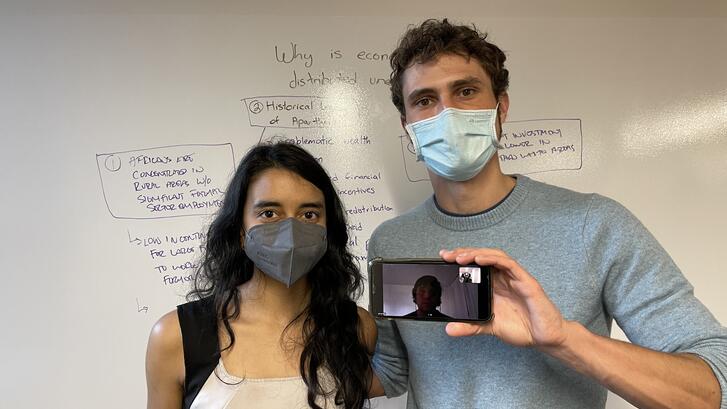 Janani Mohan, Eli MacKinnon and Leonel Diaz [pictured on phone]