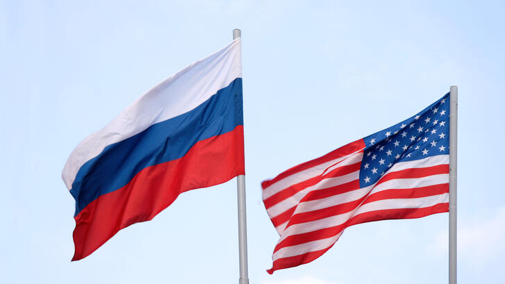 The Russian and American flags flying side by side