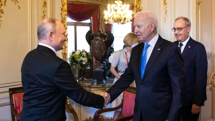 Joe Biden and Vladimir Putin shaking hands