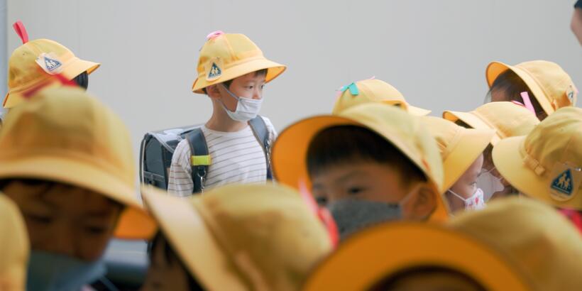 elementary kids in yellow hats