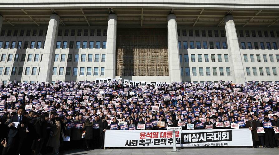 Lawmakers and members of the South Korea's main opposition Democratic Party (DP) demonstrate against the country's president at the National Assembly on December 04, 2024 in Seoul, South Korea. 