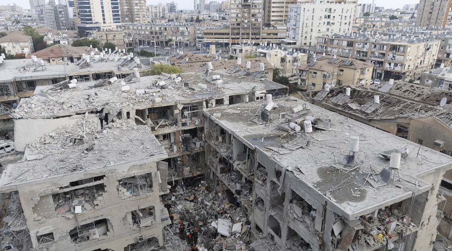 Emergency and Rescue soldiers search for trapped people inside heavily damaged buildings after an overnight missiles strike from Iran on June 15, 2025 in Bat Yam, Israel.