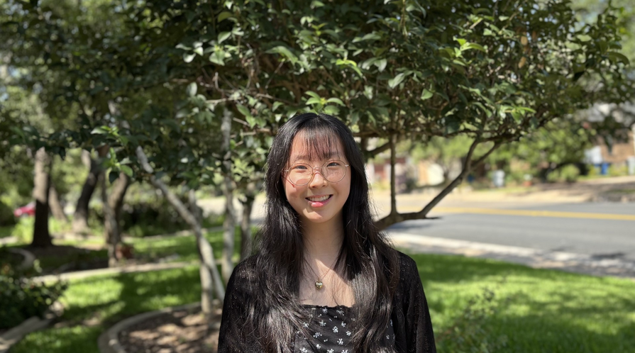a person standing in front of trees