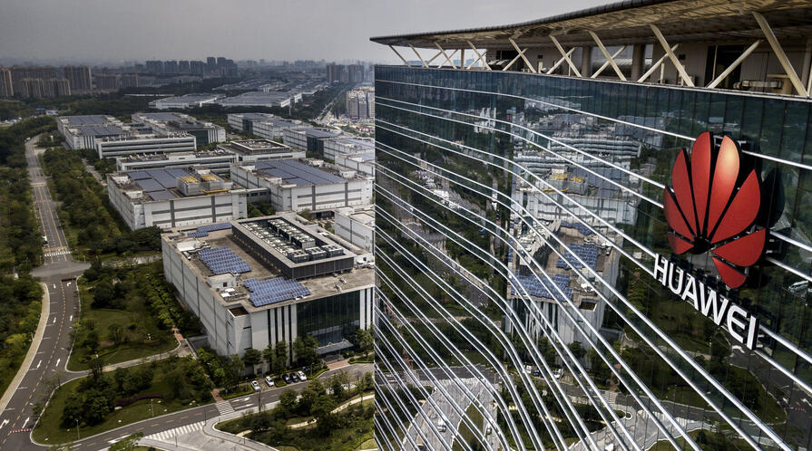 The Huawei logo is seen on the side of the main building at the company's production campus on April 25, 2019 in Dongguan, near Shenzhen, China.