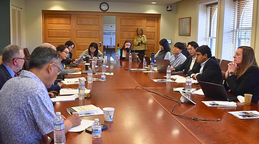 Stanford Next Asia Policy Lab team members and invited discussants during a roundtable discussion in a conference room.