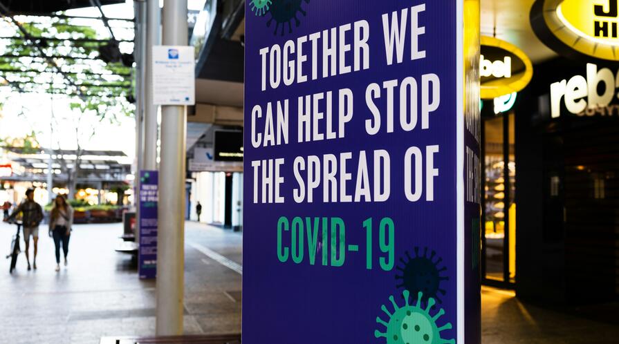 A sign that says "Together we can help stop the spread of COVID-19"