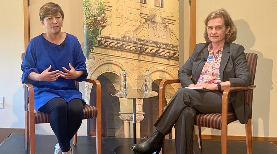 Ema Yamazaki and Katherine Monahan seated on stage during a fireside chat.