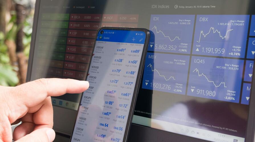 Forex trading using smartphones and laptops.
