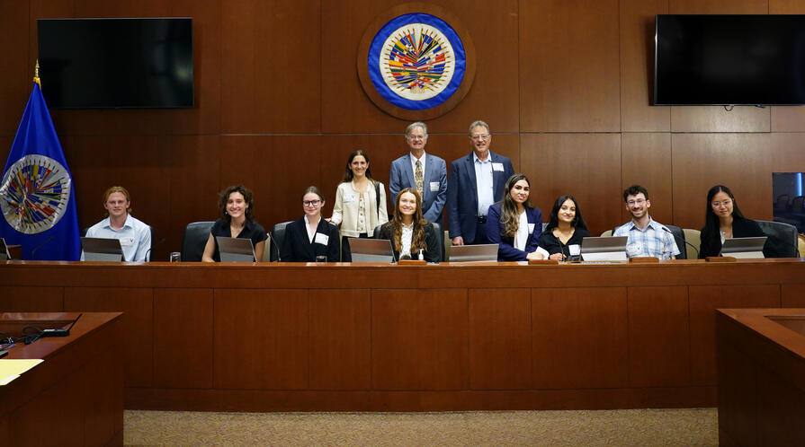 Members of the Fisher Family Honors Class of 2026 pose with faculty María Ignacia Curiel, Stephen Stedman, and Larry Diamond at the Organization of American States in Washington, D.C.