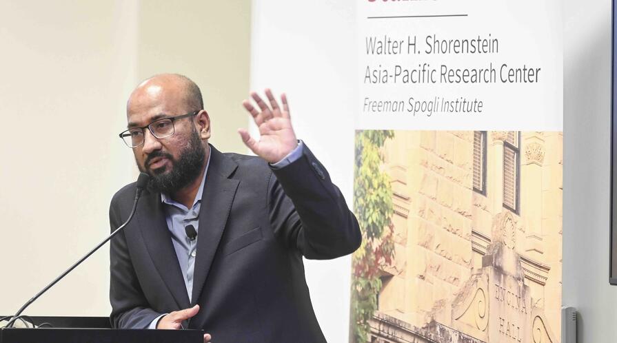 Tasneem Khalil delivers remarks at a lectern.