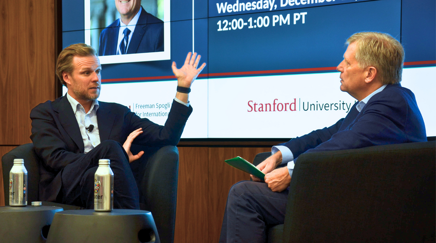 Gabrielius Landsbrgis onstage with Michael McFaul in the Green Library at Stanford University on October 10, 2025.