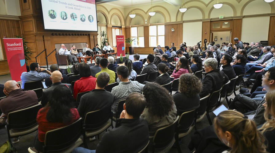 Large audience at Encina Hall listens to a discussion about global trends and geopolitics in 2026 by scholars at the Freeman Spogli Institute.