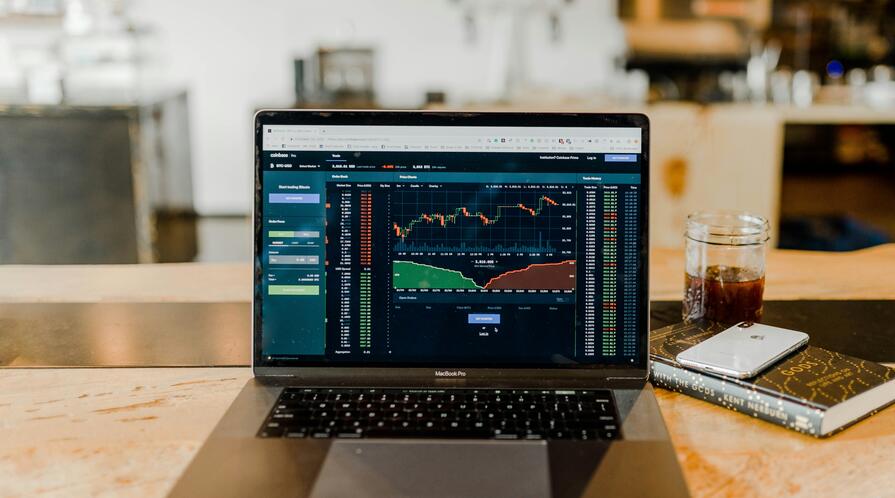 A computer showing investment charts