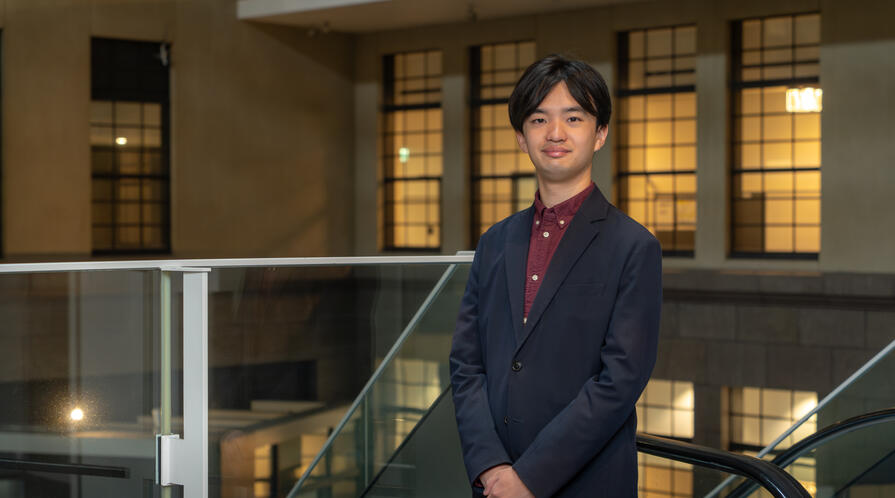 a person in a suit standing
