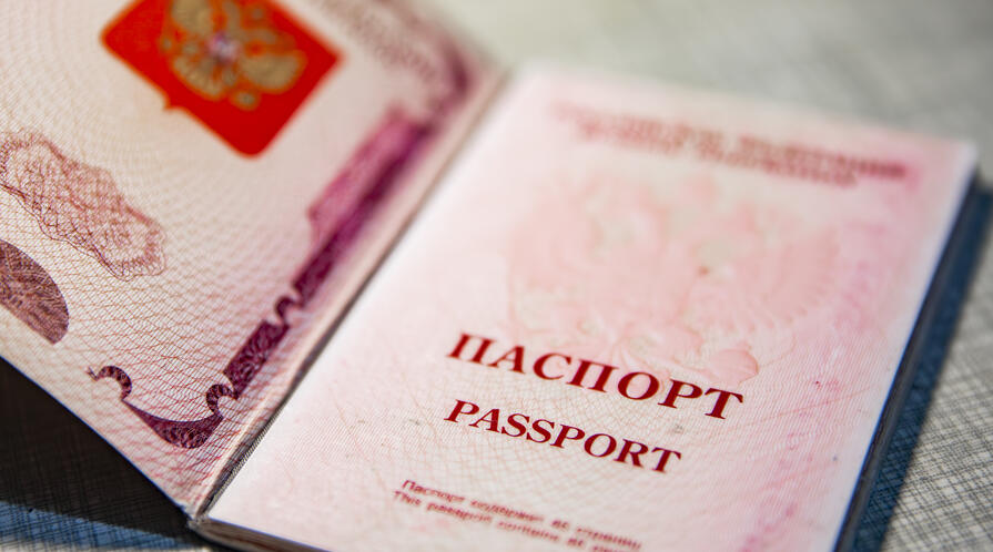 Russian passport on a gray stone background