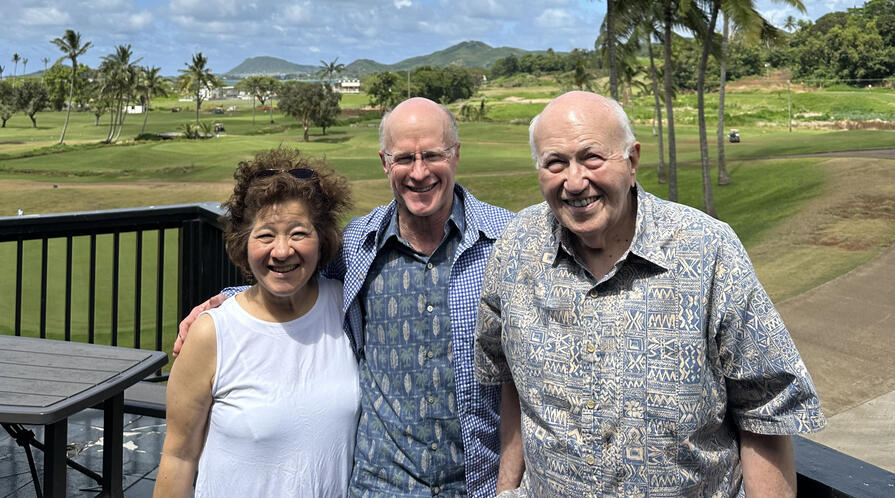 three people standing