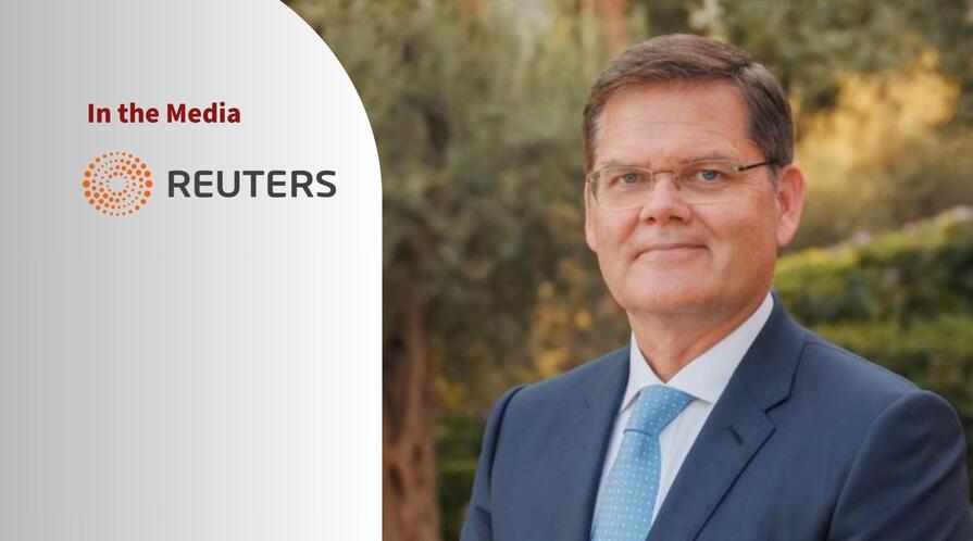 Portrait of Curtis Milhaupt and a logo of Retuers.