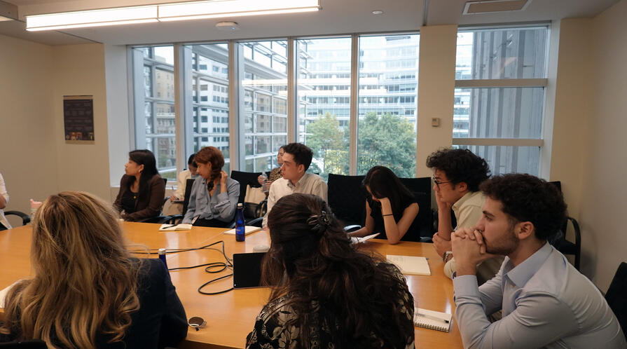 Students engage with a presentation during a site visit during Honors College.