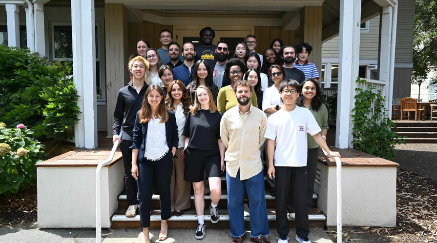 Students posing for a group photo on a set of steps