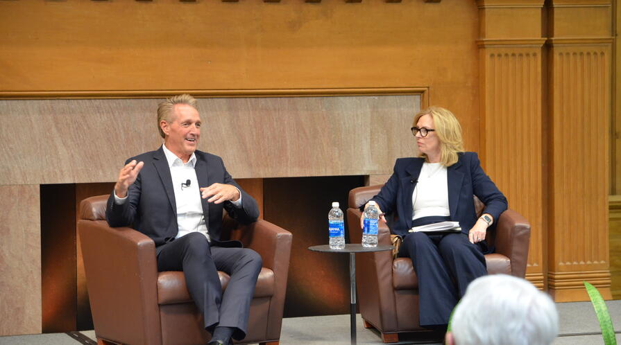 Fmr Congressman and Ambassador Jeff Flake sits on stage with Professor Kathryn Stoner.