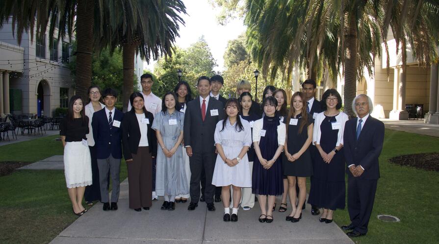 a group photo of students and instructors on campus