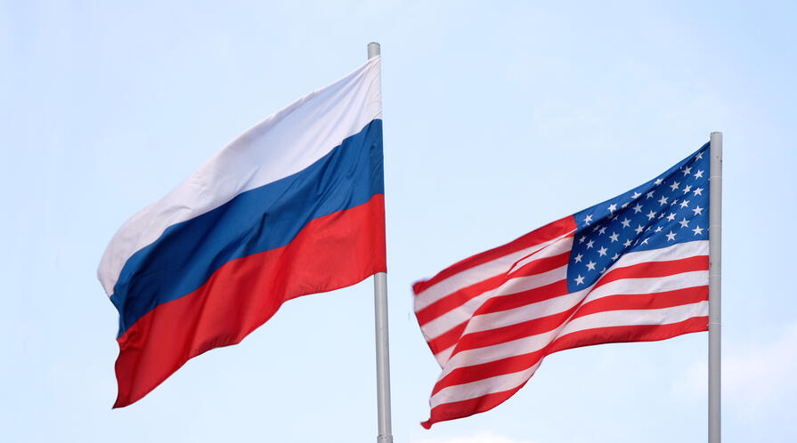 The Russian and American flags flying side by side