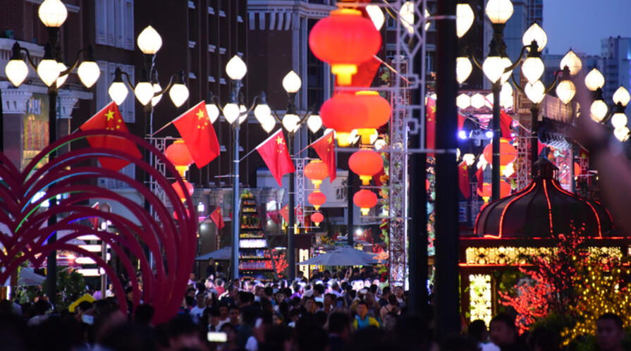 Chinese flag and lanterns on a street in China. 