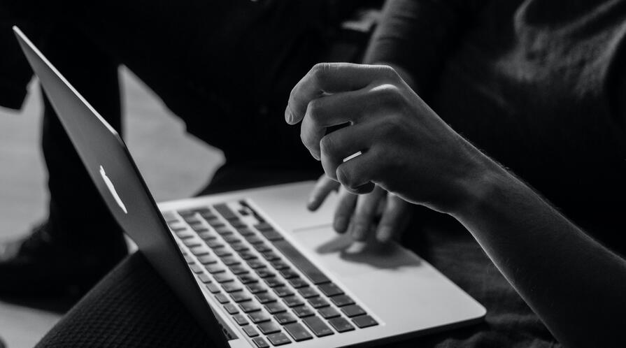image of hands typing on a laptop