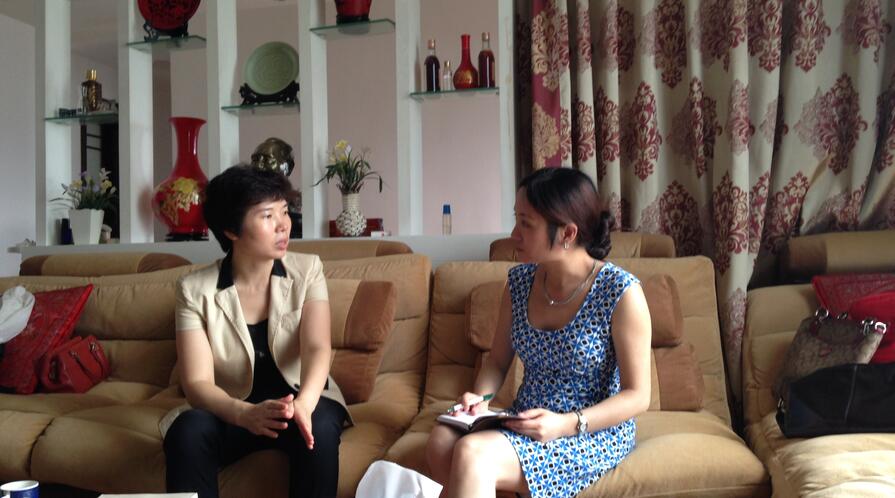 Ling Chen (at Right), a postdoctoral fellow at Shorenstein APARC, interviews a Chinese bureaucrat. picture 4