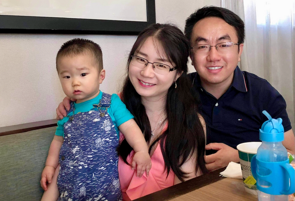 Hao Xue with his wife and baby son.