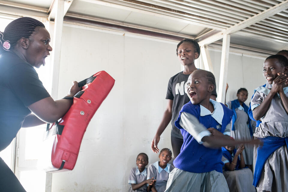 Girls in Nairobi, Kenya, learn some physical skills to protect themselves from potential sexual attackers. Photo by Nichole Sobecki